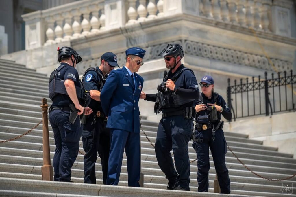 Air Force major arrested on Capitol steps during protest calling for Trump impeachment Air Force major arrested on Capitol steps during protest calling for Trump impeachment